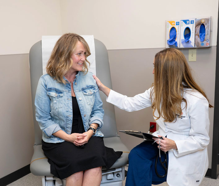 Dr. Anne Ford consulting with a female patient