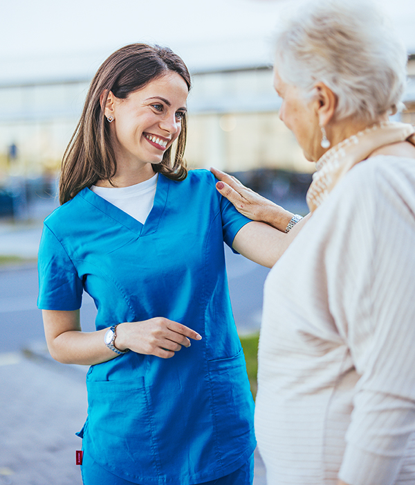 caring nurse with woman patient